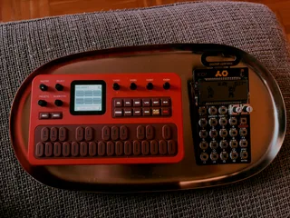 Photo of FM-1 and PO-33 sitting next to each other