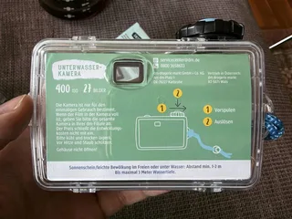 You can remove waterproof housing and see a small black camera inside that can only shoot and advance film. On the bottom there is a rewinding mechanism, technically you can remove and replace the film and use it again. But it only supports 400 ISO.