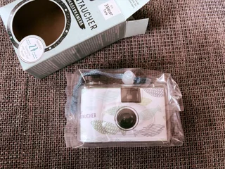 You can remove waterproof housing and see a small black camera inside that can only shoot and advance film. On the bottom there is a rewinding mechanism, technically you can remove and replace the film and use it again. But it only supports 400 ISO.