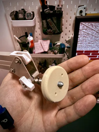 Photo of 3d printed plastic adapter which converts the end of the articulated lamp into a mic stand screw